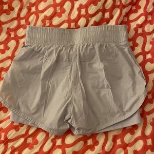 Athleta periwinkle shorts with biker shorts underneath